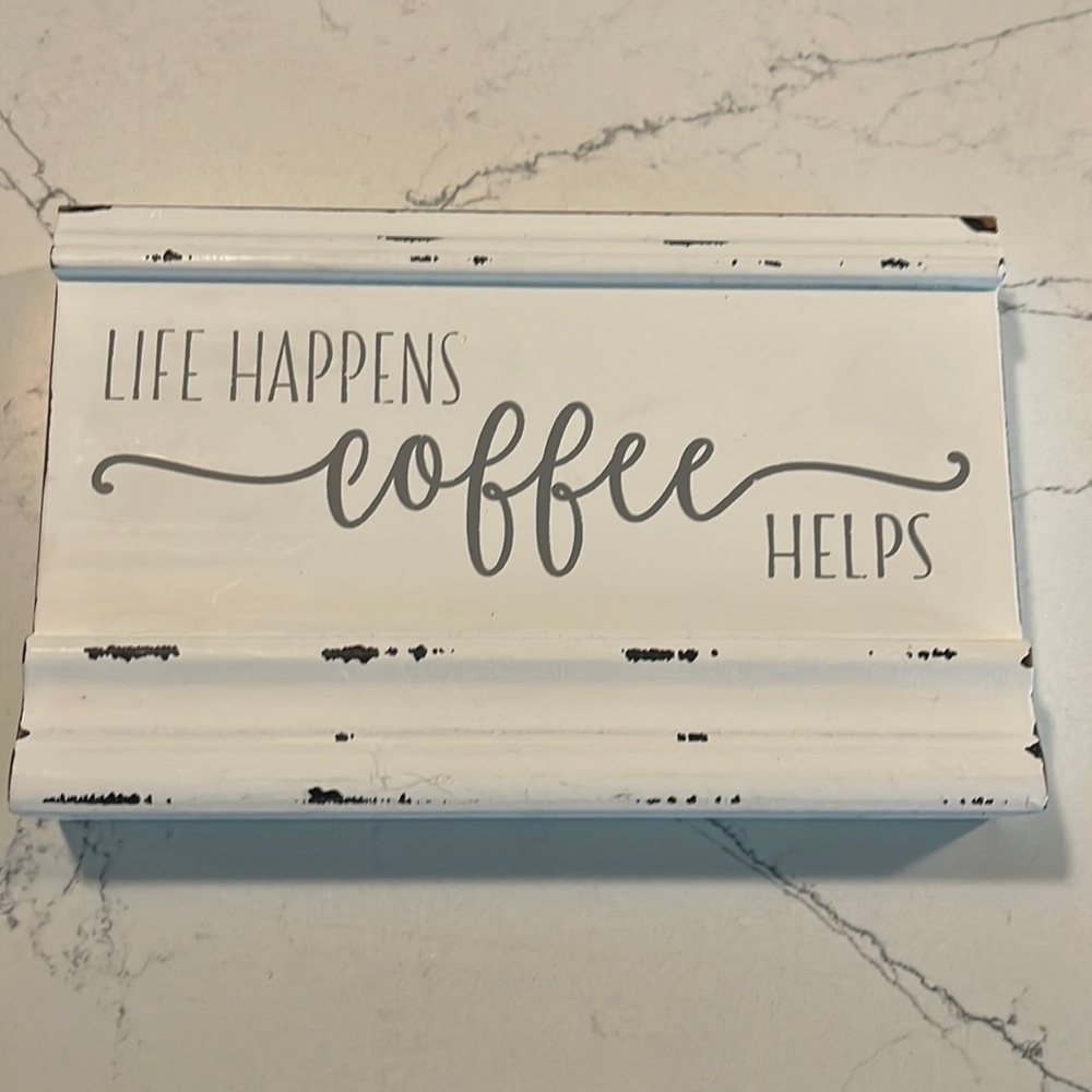 “Life Happens Coffee Helps” sign